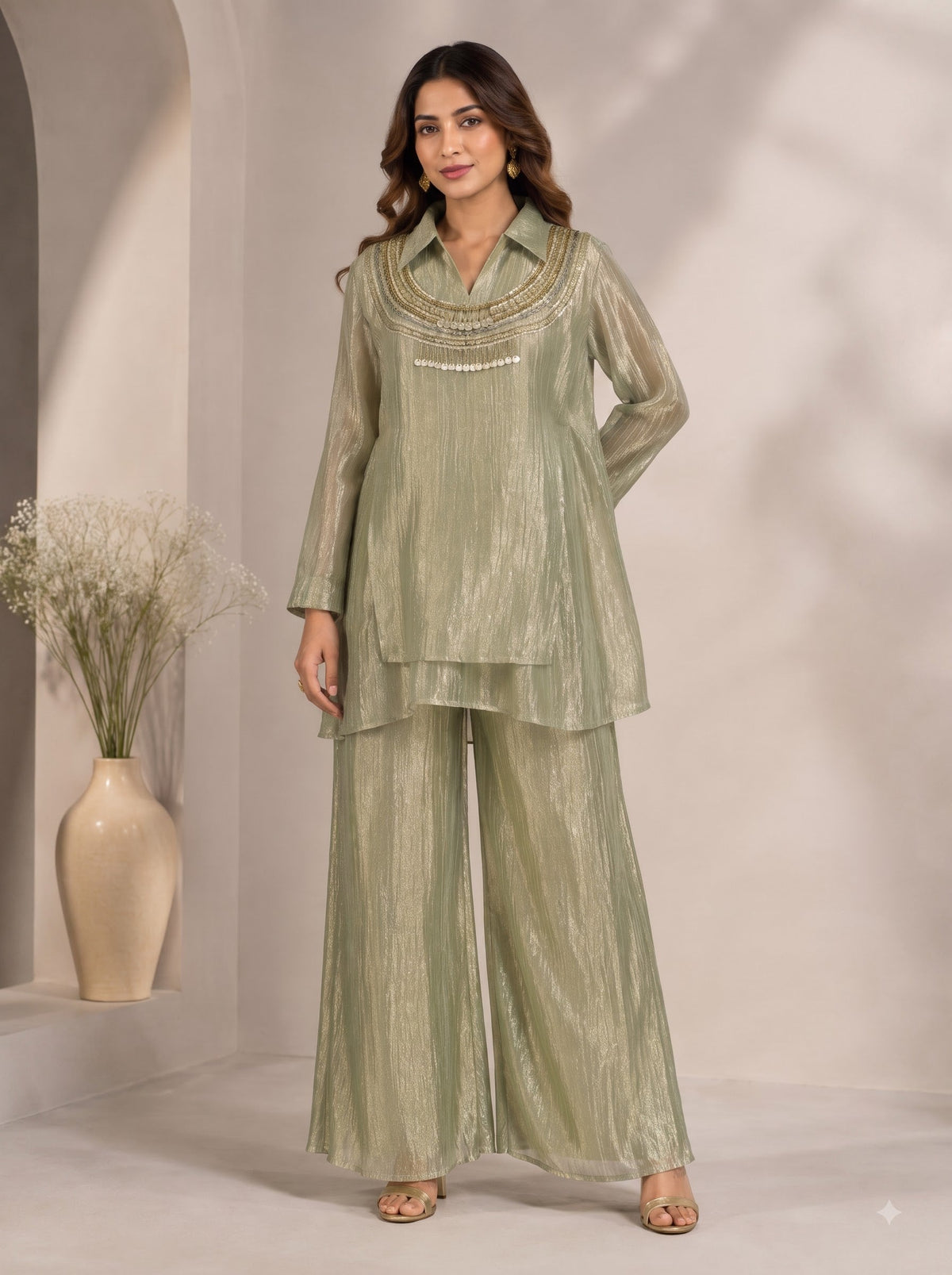 Model wearing a Jinisha Bafana Collection sage green crinkled metallic tissue tunic and wide-leg palazzo co-ord set.